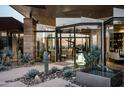 Glass entryway to modern home with desert landscaping at 38300 N 102Nd St, Scottsdale, AZ 85262