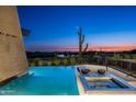 Infinity pool and spa with desert sunset views at 38300 N 102Nd St, Scottsdale, AZ 85262