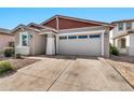 Modern home with a two-car garage and neutral exterior at 5932 S 26Th Ave, Phoenix, AZ 85041