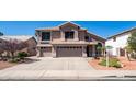 Charming two-story home featuring a three car garage and well-manicured landscaping at 6178 W Quail Ave, Glendale, AZ 85308