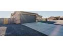 Attached two-car garage with a concrete driveway at 8519 W Teresita Dr, Arizona City, AZ 85123