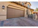 Three-car garage with paver driveway at 9127 E Lynwood St, Mesa, AZ 85207