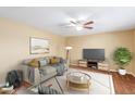 Virtually staged living room features a neutral color palette and stylish furniture at 9607 N 41St Dr, Phoenix, AZ 85051