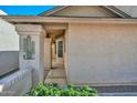 Side entrance with a walkway leading to the front door at 10405 N 65Th Dr, Glendale, AZ 85302