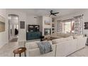 Spacious living room with fireplace, large sectional sofa, and TV at 14806 E Crested Crown --, Fountain Hills, AZ 85268