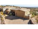 Single-story home with a large garage and desert landscaping at 14849 E Valley Vista Dr, Fountain Hills, AZ 85268