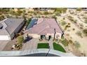 Single story house with tile roof and a two-car garage at 21122 W Edgemont Ave, Buckeye, AZ 85396