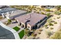 Single-story house with tile roof and solar panels, viewed from above at 21122 W Edgemont Ave, Buckeye, AZ 85396