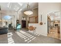 Bright living room featuring high ceilings and stylish furnishings at 2249 E Taxidea Way, Phoenix, AZ 85048