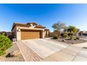 Single-story house with brown garage door and small front yard at 26407 N 166Th Ave, Surprise, AZ 85387