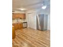 Kitchen with stainless steel appliances and wood cabinets at 3409 W Mandalay Ln, Phoenix, AZ 85053