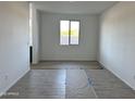 Bright and spacious room with tile flooring and a large window offers abundant natural light at 5510 W Paseo Way, Laveen, AZ 85339
