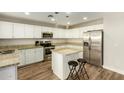 Kitchen boasts granite countertops and stainless steel appliances at 728 E Payton St, San Tan Valley, AZ 85140