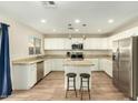 Spacious kitchen with island, granite counters, and stainless steel appliances at 728 E Payton St, San Tan Valley, AZ 85140