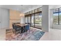 Elegant dining room with a large table and access to a patio at 8 E Biltmore Est # 117, Phoenix, AZ 85016