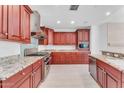 Modern kitchen with stainless steel appliances and granite countertops at 8 E Biltmore Est # 117, Phoenix, AZ 85016