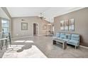 Open living area with tile floor and vaulted ceiling at 18022 N Hyacinth Dr, Sun City West, AZ 85375