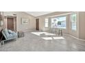 Bright living room with tile flooring and bay window at 18022 N Hyacinth Dr, Sun City West, AZ 85375