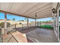 Covered patio with artificial turf and metal fencing at 18022 N Hyacinth Dr, Sun City West, AZ 85375