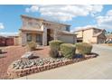 Two-story house with landscaped front yard and attached two-car garage at 22194 N Kingston Dr, Maricopa, AZ 85138