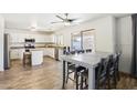 Spacious kitchen with island, stainless steel appliances, and light cabinets at 22194 N Kingston Dr, Maricopa, AZ 85138