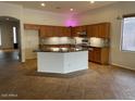 Open kitchen featuring a spacious island, granite countertops, and stainless steel appliances at 4943 S Las Mananitas Trl, Gold Canyon, AZ 85118