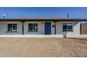 House exterior with blue front door and a neat front yard at 7519 N 23Rd Ave, Phoenix, AZ 85021