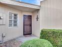 Condo entry with security door and small potted plants at 10505 W Ocotillo Dr, Sun City, AZ 85373