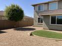 Landscaped yard with gravel and a small lawn at 14727 W Pasadena Ave, Litchfield Park, AZ 85340