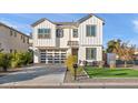 Two-story white house with gray accents, modern garage, and small lawn at 3750 E Earll Dr, Phoenix, AZ 85018