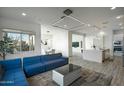 Open living space featuring modern decor and a large sectional sofa at 1553 N 69Th Pl, Scottsdale, AZ 85257