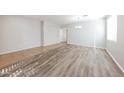 Bright dining room with wood-look flooring and ample natural light at 15930 W Redfield Rd, Surprise, AZ 85379