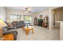 Spacious living room with tile floors and comfy seating at 20516 N Vermillion Cliffs Dr, Surprise, AZ 85387