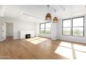 Bright living room with hardwood floors and fireplace at 535 W Thomas Rd # 508, Phoenix, AZ 85013
