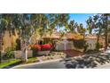 Two-story house with lush landscaping and a two car garage at 7500 E Mccormick Pkwy # 11, Scottsdale, AZ 85258