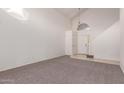 Spacious entryway with carpeted floors and staircase at 1203 E Muriel Dr, Phoenix, AZ 85022