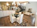 Elegant dining area with a glass table and four white chairs at 1326 N Central Ave # 416, Phoenix, AZ 85004