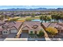 Aerial view of home with stunning mountain views and golf course location at 26573 W Abraham Ln, Buckeye, AZ 85396