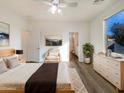 Main bedroom with ensuite bathroom and large window at 37803 W La Paz St, Maricopa, AZ 85138