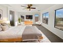 Spacious main bedroom with large windows and modern dresser at 37855 W Merced St, Maricopa, AZ 85138