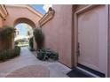 Front entry with arched walkway and landscaping at 3800 S Cantabria Cir # 1029, Chandler, AZ 85248