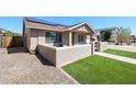 Charming single-story home featuring a well-maintained landscape, stucco walls, and solar panels for energy efficiency at 6352 W Campo Bello Dr, Glendale, AZ 85308