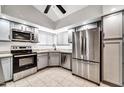 Modern kitchen with stainless steel appliances and granite countertops at 6427 W Turquoise Ave, Glendale, AZ 85302
