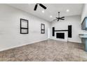Spacious living room with fireplace and tile floors at 6427 W Turquoise Ave, Glendale, AZ 85302