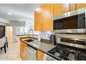 Modern kitchen featuring stainless steel appliances and granite counters at 6900 E Princess Dr # 1132, Phoenix, AZ 85054