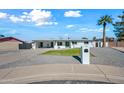 Updated single-story home with a landscaped front yard and driveway at 1344 E Ellis Cir, Mesa, AZ 85203