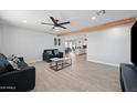 Open concept living room with a view into the kitchen at 1344 E Ellis Cir, Mesa, AZ 85203