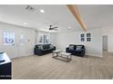 Bright living room featuring tile floors and two sofas at 1344 E Ellis Cir, Mesa, AZ 85203