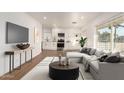 Living Room with gray sectional sofa and modern coffee table at 2024 E Whitton Ave, Phoenix, AZ 85016