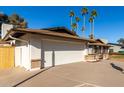 Two-car garage and wood fence at 2664 W Ocaso Cir, Mesa, AZ 85202